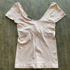 Light pink Bebe short sleeve shirt size medium/large